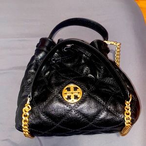 All black leather Tory Burch purse with strap